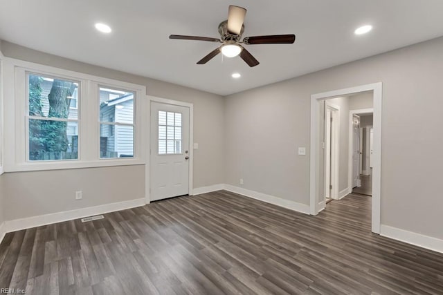 entrance foyer featuring ceiling fan and dark wood-type flooring