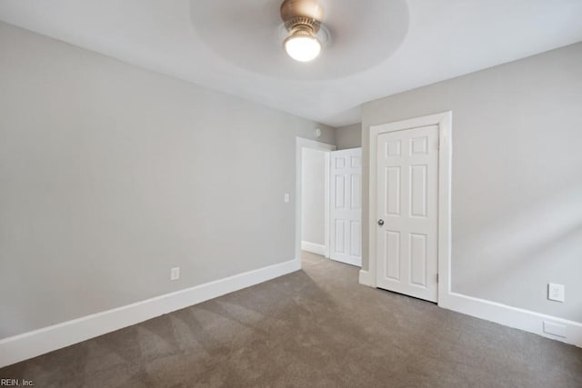 unfurnished bedroom with carpet floors and ceiling fan