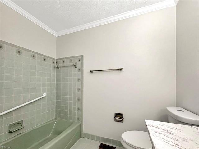 full bathroom with tiled shower / bath combo, tile patterned flooring, a textured ceiling, toilet, and vanity