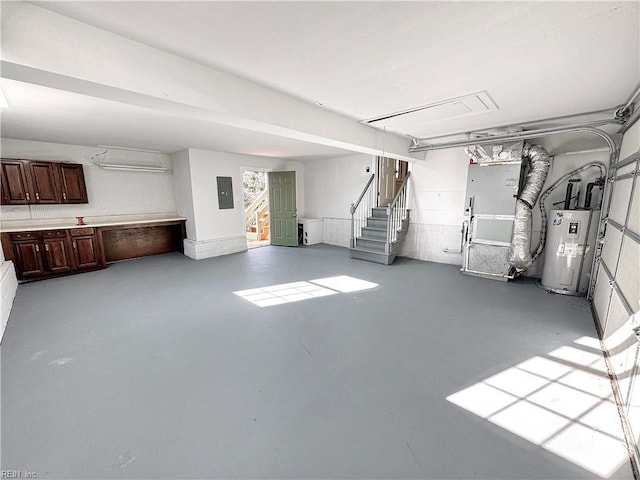 basement featuring electric water heater, electric panel, and heating unit