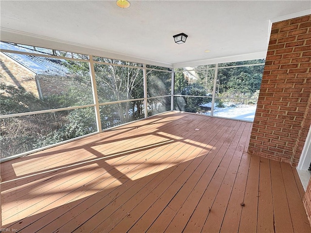 unfurnished sunroom featuring a healthy amount of sunlight