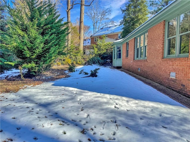 view of yard covered in snow