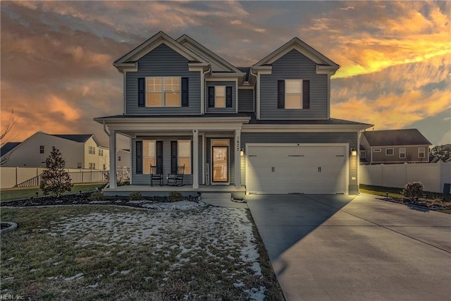 view of front of home with a garage and a porch