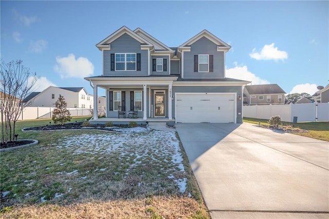 view of front of home featuring covered porch and a garage