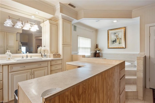 bathroom featuring vanity, crown molding, tile patterned flooring, and a relaxing tiled tub