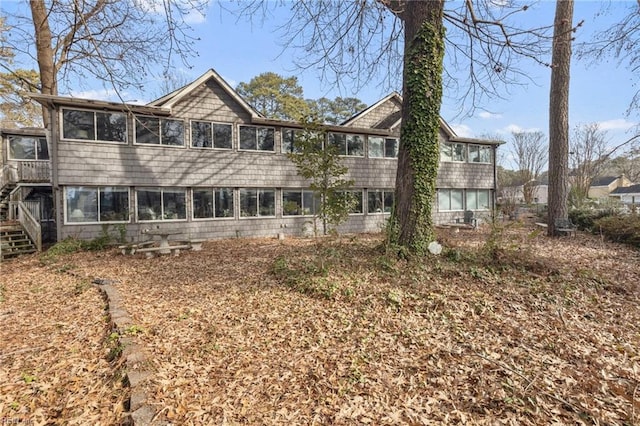 rear view of property with a sunroom