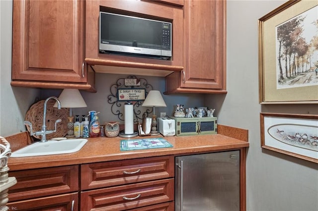 bar with refrigerator and sink