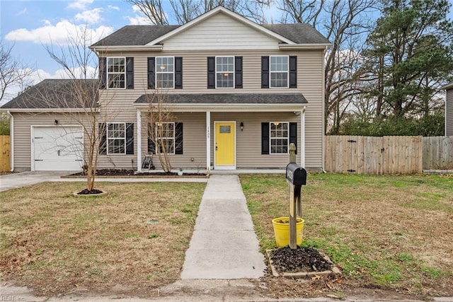 view of front of property with a front lawn and a garage