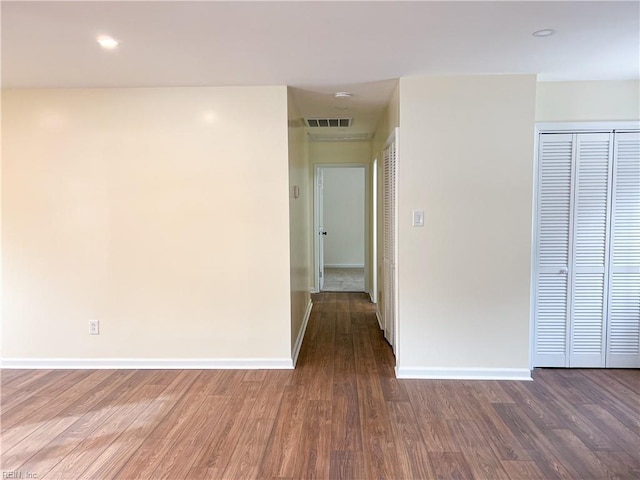 unfurnished room featuring hardwood / wood-style floors