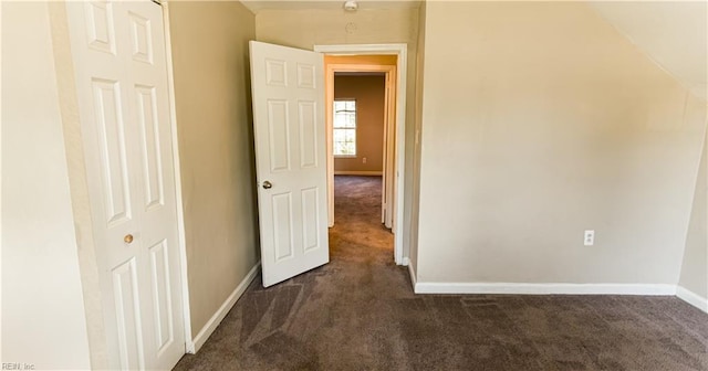 hallway with dark carpet