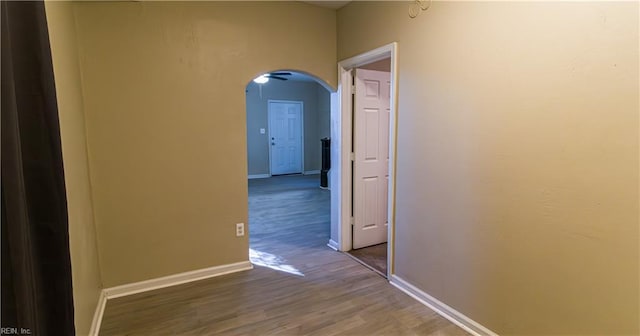 corridor featuring hardwood / wood-style floors