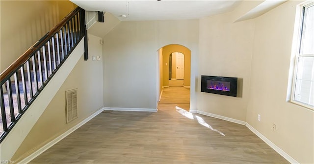 staircase featuring wood-type flooring