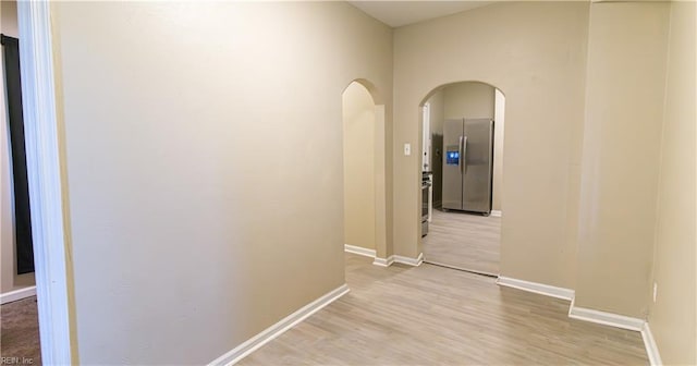 hallway with light wood-type flooring