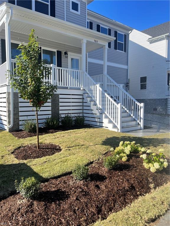 view of front of home with a porch and a front lawn