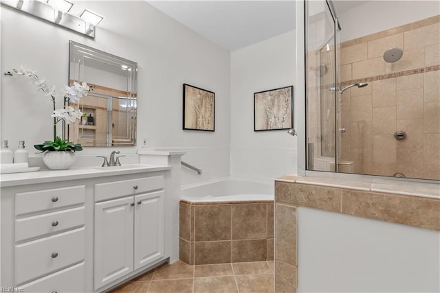 bathroom featuring tile patterned flooring, vanity, and independent shower and bath