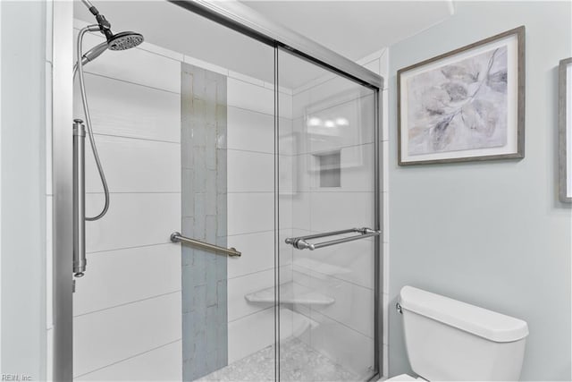 bathroom with toilet and walk in shower