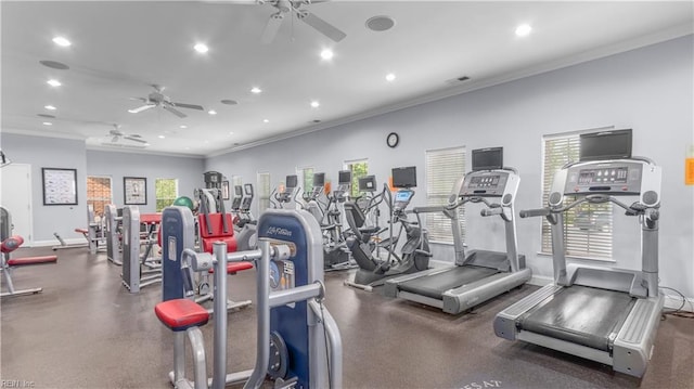 workout area featuring ceiling fan, a healthy amount of sunlight, and ornamental molding