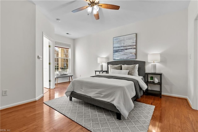 bedroom with hardwood / wood-style flooring and ceiling fan