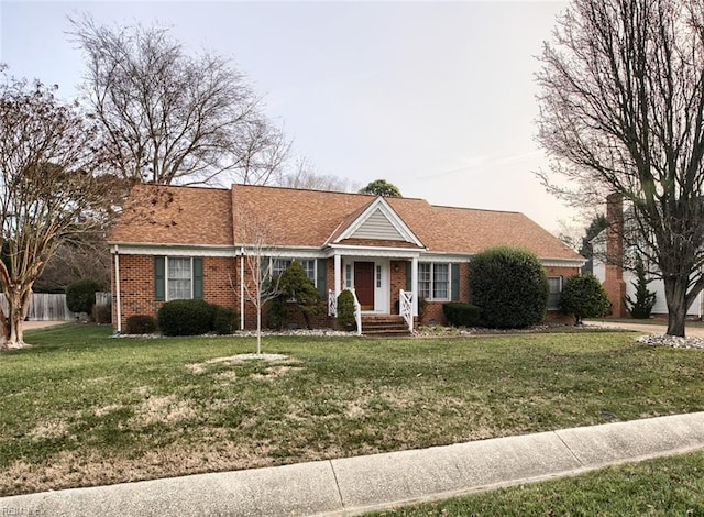 single story home with a front lawn