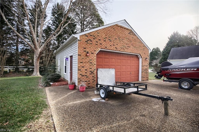 view of side of property featuring a garage and an outbuilding