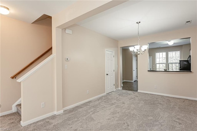 unfurnished room with carpet and an inviting chandelier