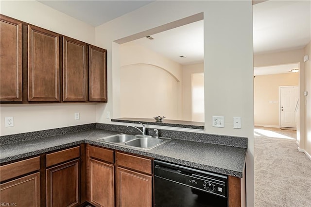 kitchen featuring light carpet, kitchen peninsula, dark brown cabinets, sink, and dishwasher