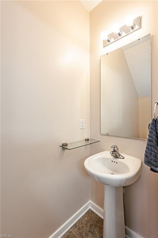 bathroom with tile patterned floors