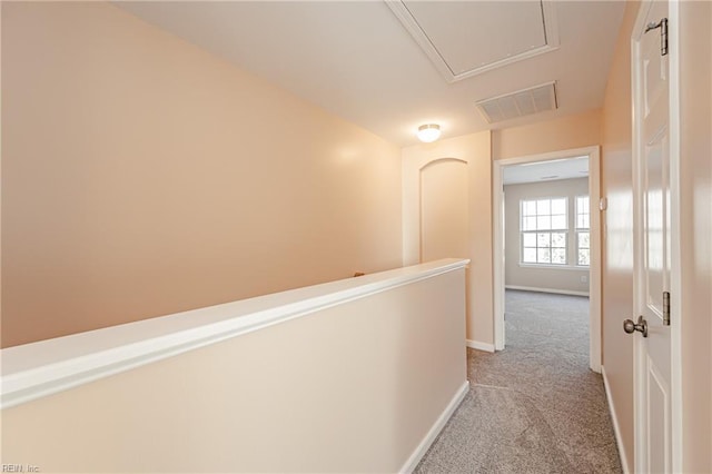 corridor with light colored carpet