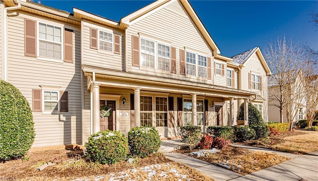 townhome / multi-family property with covered porch