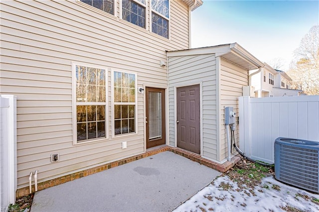 entrance to property featuring cooling unit