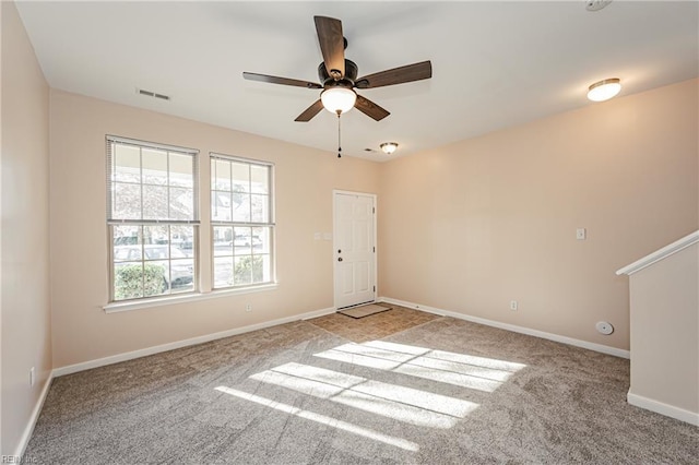 carpeted empty room with ceiling fan