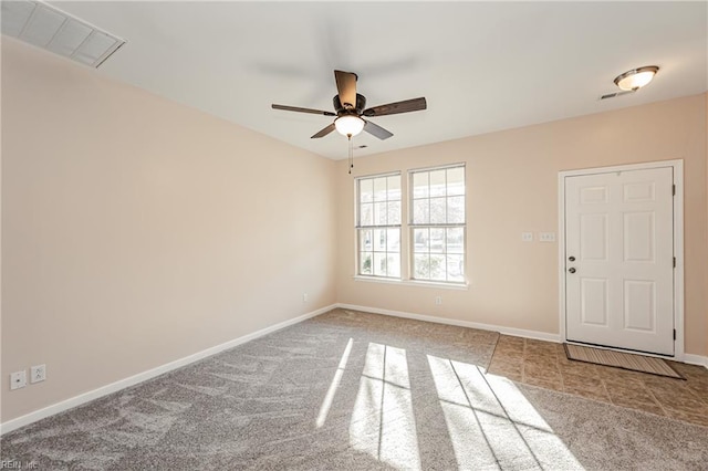 carpeted empty room with ceiling fan