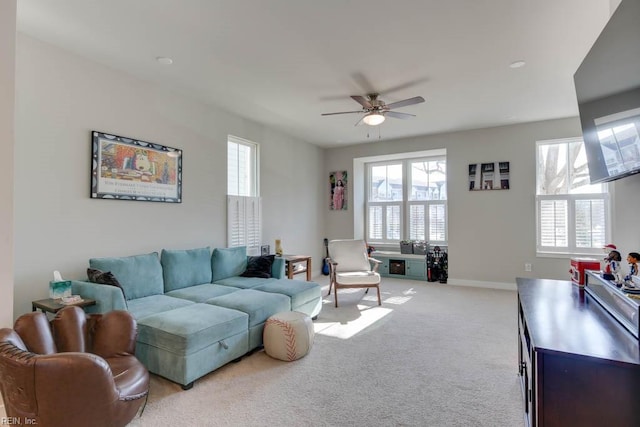 living room with carpet flooring and ceiling fan