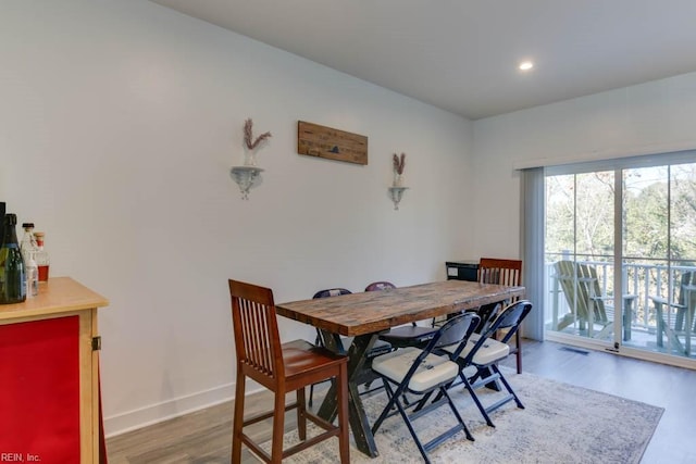 dining space featuring hardwood / wood-style floors