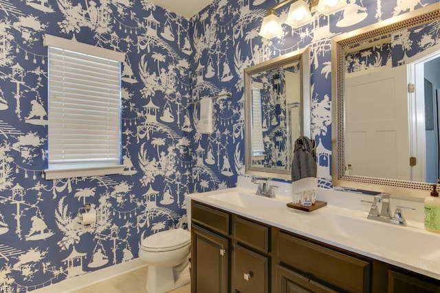 bathroom featuring tile patterned floors, vanity, and toilet