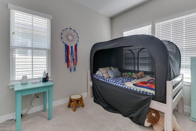 bedroom featuring light carpet