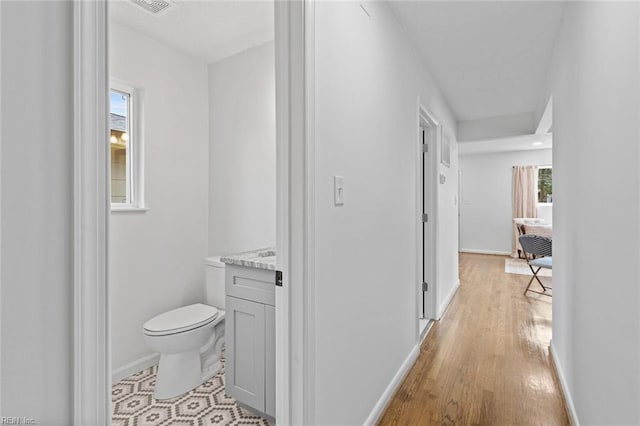 hall with light hardwood / wood-style floors