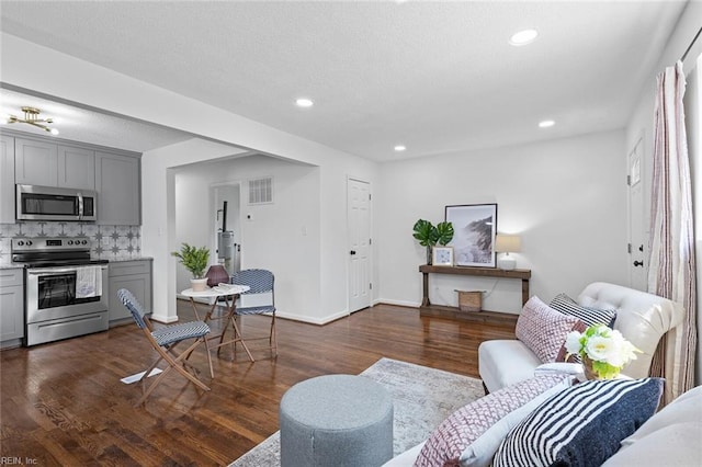 living room with dark hardwood / wood-style flooring