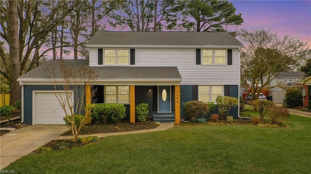 view of front of house with a garage and a lawn