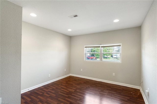 empty room with dark hardwood / wood-style floors