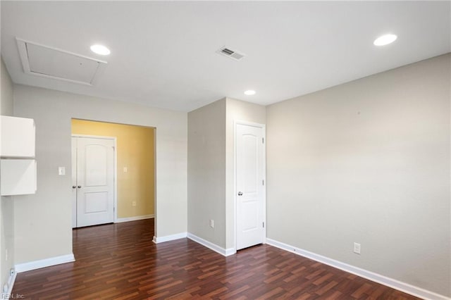 empty room with dark wood-type flooring