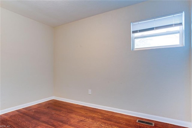 unfurnished room featuring hardwood / wood-style floors