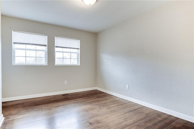 spare room featuring hardwood / wood-style flooring