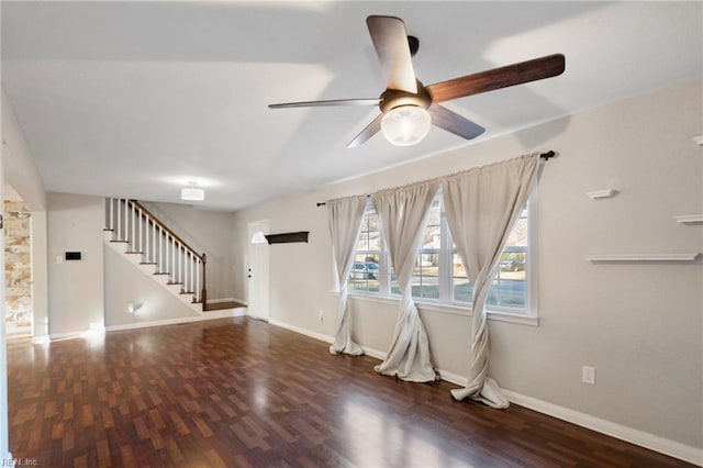 interior space featuring ceiling fan and dark wood-type flooring