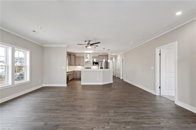 unfurnished living room with dark hardwood / wood-style flooring, ornamental molding, and ceiling fan