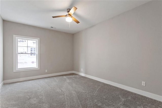 carpeted empty room with ceiling fan