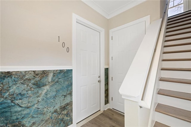 interior space with crown molding and wood-type flooring