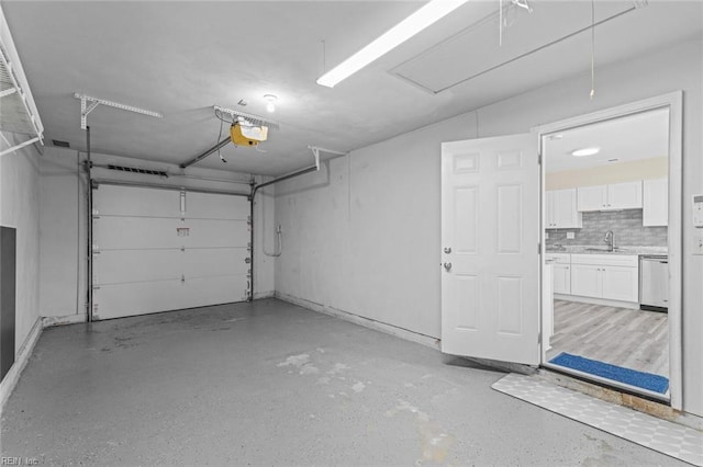 garage with sink and a garage door opener