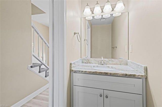 bathroom featuring vanity and hardwood / wood-style flooring