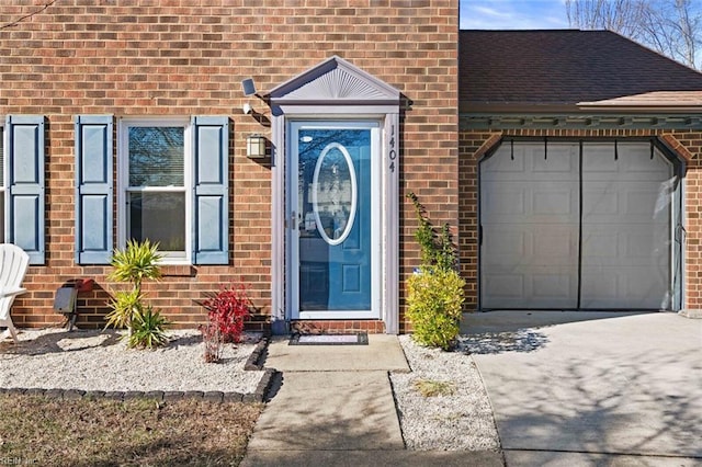 doorway to property featuring a garage